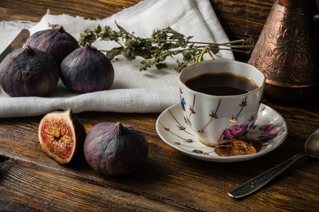 Tasty coffee break with ripe and juicy figs.の写真素材