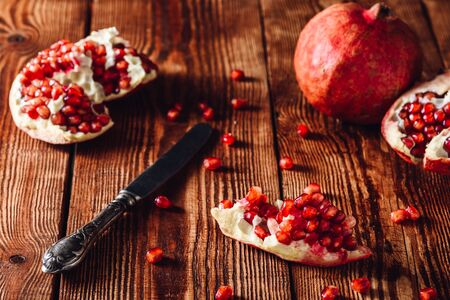 Opened Pomegranate Fruit, Seeds and Vintage Knifeの写真素材