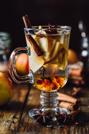 Hot Spiced Beverage with Sliced Apples and Different Condiment.の写真素材