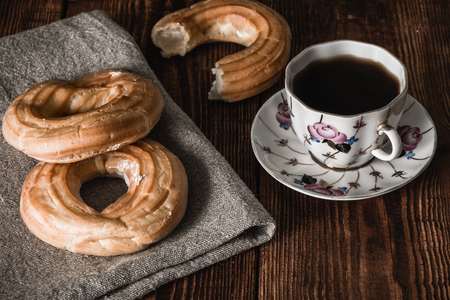 Still Life with Two Round Eclairs and Cup of Coffeeの写真素材