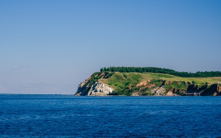 Cliffed Coast of the River with Forest on Cliff.の写真素材