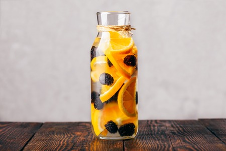 Bottle of Detox Water Infused with Sliced Raw Orangeの写真素材
