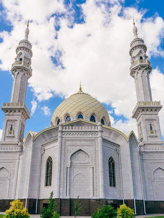 Beautiful White Mosque at the Sunny Day with Clouds.の写真素材