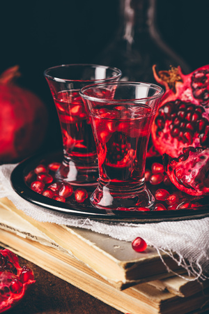 Sweet pomegranate cocktail with vodka, juice and fresh fruitsの写真素材