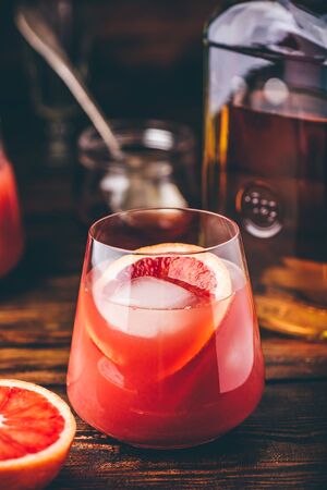 Whiskey sour cocktail with aged bourbon, blood orange juice and simple syrupの写真素材