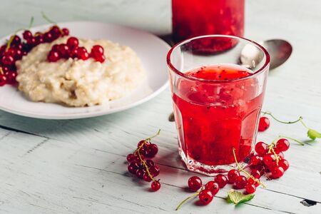 Simple and healthy breakfast with porridge and infused water with berriesの写真素材