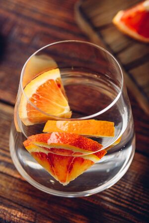 Detox water with blood oranges in drinking glassの写真素材