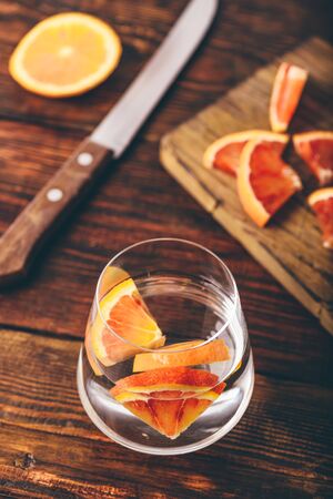 Water infused with red oranges in glassの写真素材