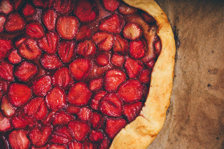 Close Up Of Fresh Baked Strawberry Galette On Baking Paper. View from Aboveの写真素材