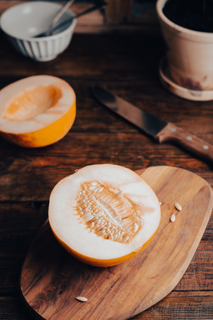 Half of Honeydew Melon on Cutting Boardの写真素材