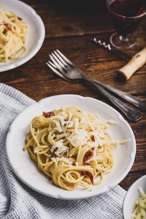 Homamade classic spaghetti carbonara on white plateの写真素材
