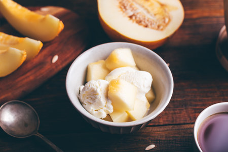 Ice Cream with Honeydew Melon Slices in Bowlの写真素材