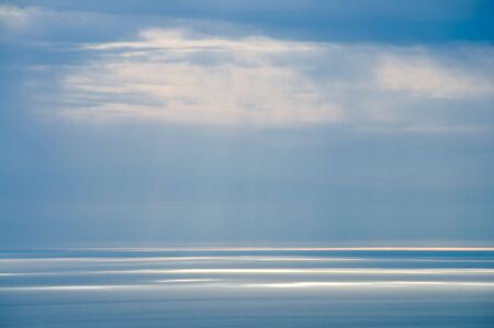 Beams through clouds on the see 