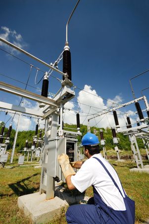 Electrician repairing electric panelの写真素材