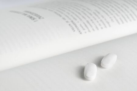 Pills on bookの写真素材