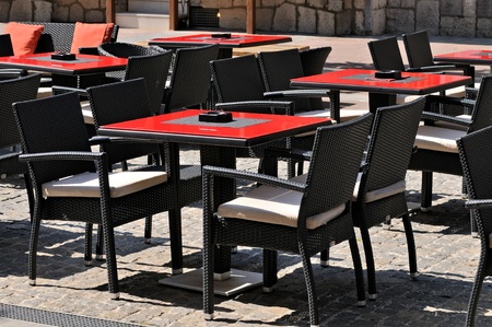 Empty tables and chairs in a outdoor cafe の写真素材