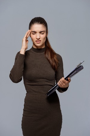 Beautiful young girl  holding tablet in handの写真素材