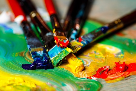 Close up photo of oil paints and brushes on palette. Copy space.の写真素材