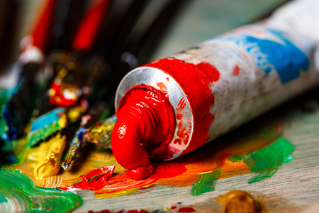 Close up photo of oil paints and brushes on palette. Copy space.の写真素材