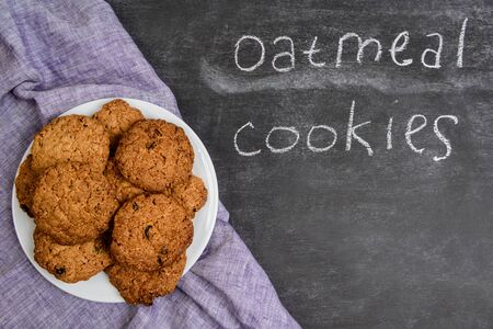 Sweet oatmeal  cookies on wooden tableの写真素材