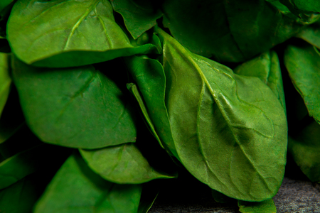 Greens over wooden grey background