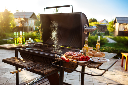 Barbecue grill party. Tasty food on wooden desk.の写真素材