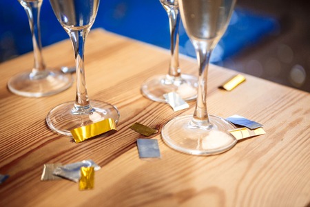 Close up photo of four glasses with champagne at party.の写真素材