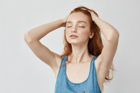 Portrait of beautiful ginger model with closed eyes.の写真素材