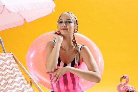 Summer closeup of charming girl with beach accessories outdoorsの写真素材