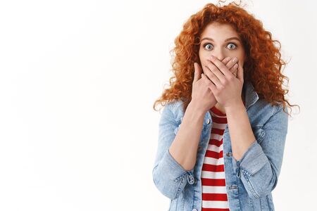 Shocked concerned young redhead female friend reacting shocking terrifying news gasping scared close...