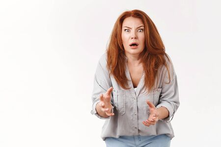 You did what. Shocked intense worried redhead disappointed middle-aged woman speechless stare camera...