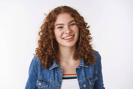 Charming lucky queer european girl ginger curly-haired freckles pimples smiling broadly without...
