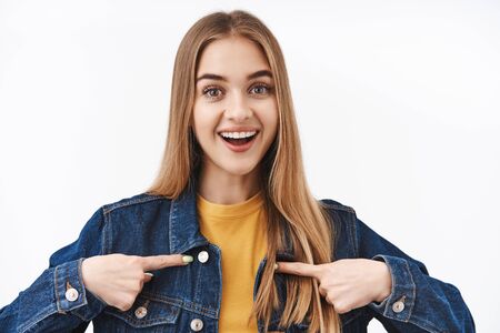 Close-up portrait excted and happy cute young woman with blond hair asking to become member, want...
