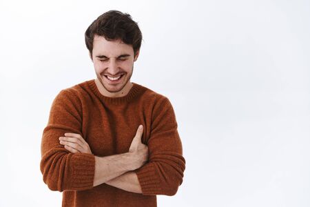 Emotions, happiness and lifestyle concept. Happy smiling handsome man laughing and joking around,...