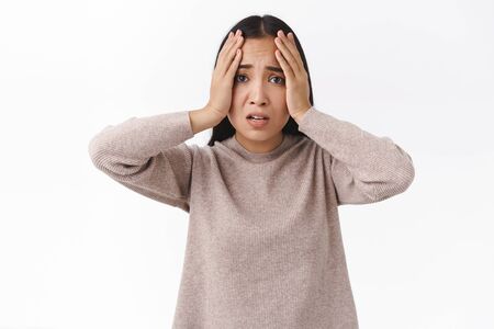 Troubled indecisive and sad young cute asian girl have problems with meeting deadline, dont know how...