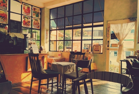 An empty vintage coffee cafe with late afternoon sun light.