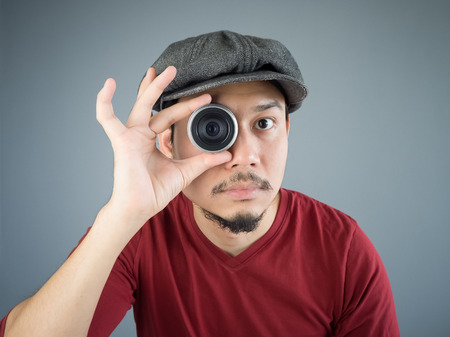 Asian Photergrapher is capturing a picture.の写真素材