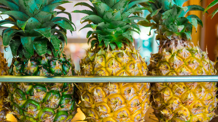 Pineapples in a fresh juice shop.の写真素材