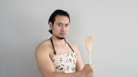 Asian husband ready to cook.の写真素材