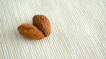 Heart shape of almonds.の写真素材