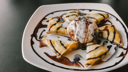 Ice-cream crepe with chocolate on top overall.の写真素材