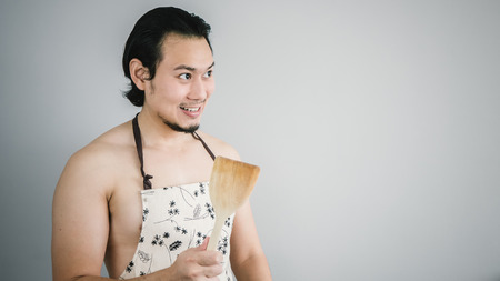 Asian husband ready to cook.の写真素材