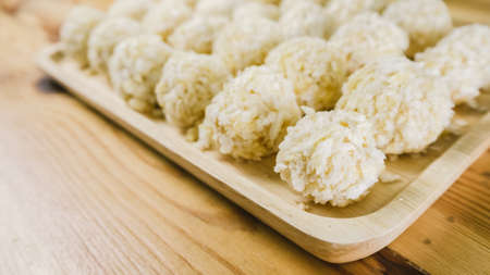 Preparing cheese balls on wooden plate.の写真素材