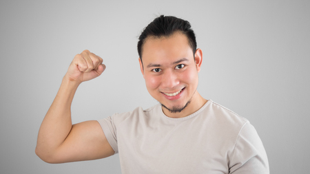 Healthy Asian man on grey t-shirt.の写真素材
