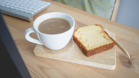 Coffee break set on work desk.
