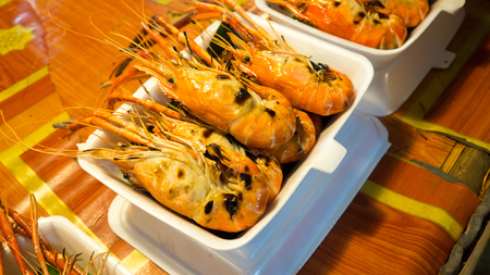 Grilled shrimps in foam lunh box.の写真素材
