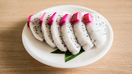 Sliced Dragon fruit on white dish.の写真素材