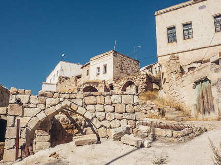 ORTAHISAR, CAPPADOCIA, TURKEYâ SEPTEMBER 16 2016: Ortahisar is famous for its friendly inhabitants, picturesque stone houses, narrow streets and lovely churches as well as the castle-like rock formation after which the town is named.のeditorial素材