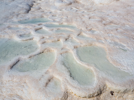 PAMUKKALE, DENIZLI, TURKEY - SEPTEMBER 14 2016: Pamukkale, meaning "cotton castle" in Turkish, is a natural site in Denizli Province in southwestern Turkey. The city contains hot springs and travertines.のeditorial素材