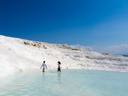 PAMUKKALE, DENIZLI, TURKEY - SEPTEMBER 14 2016: Pamukkale, meaning "cotton castle" in Turkish, is a natural site in Denizli Province in southwestern Turkey. The city contains hot springs and travertines.のeditorial素材